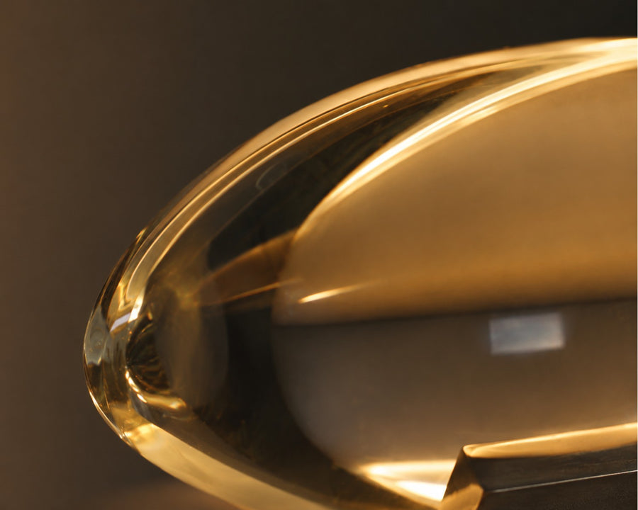 Close detail of the clear crystal shade catching warm light