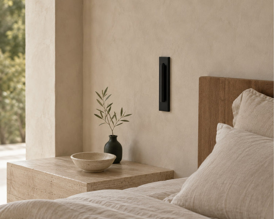 The sconce folded flush against the wall