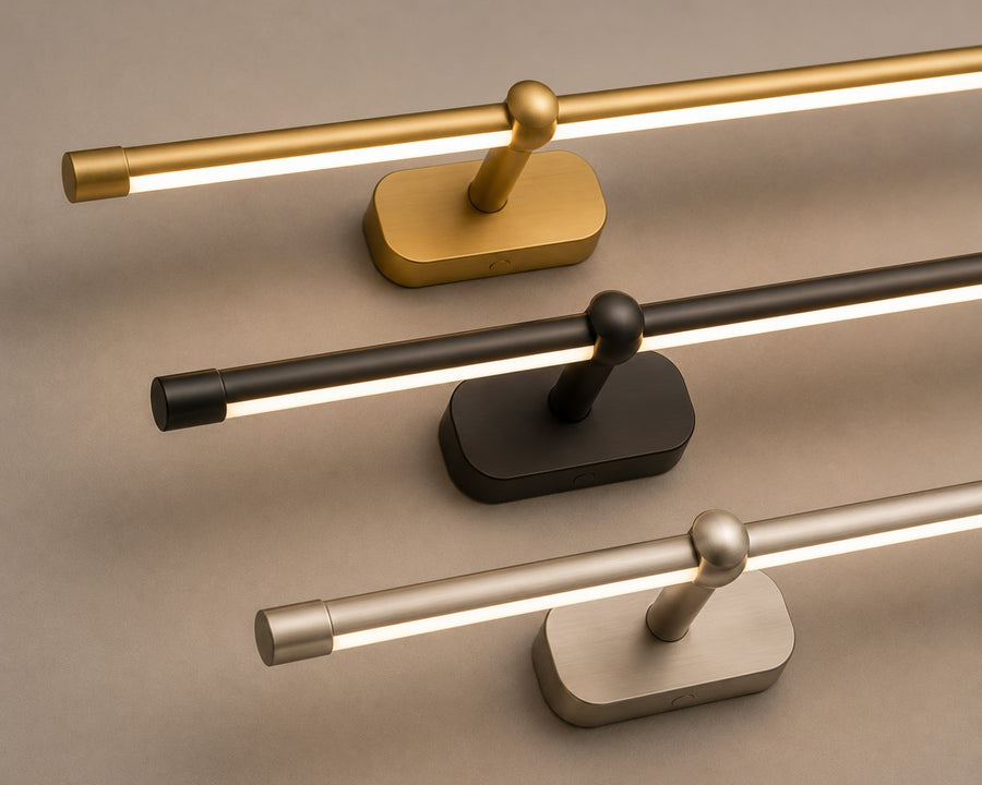 The lamp shown in gold, black + gold and brushed nickel + gold finishes