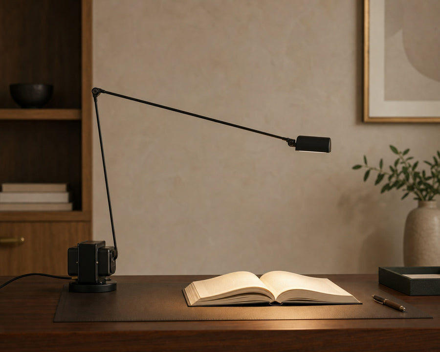 The PivotLamp arm extended across a desk