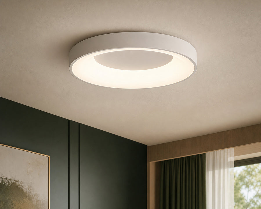 The slim flush mount glowing evenly on a ceiling