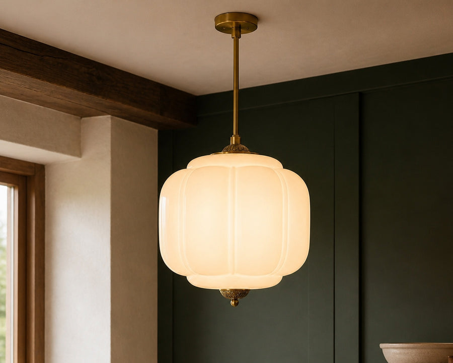The milk-glass shade lit, showing a soft even glow