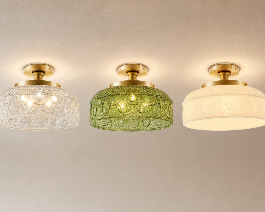 The disc light in clear, green, and milk white glass