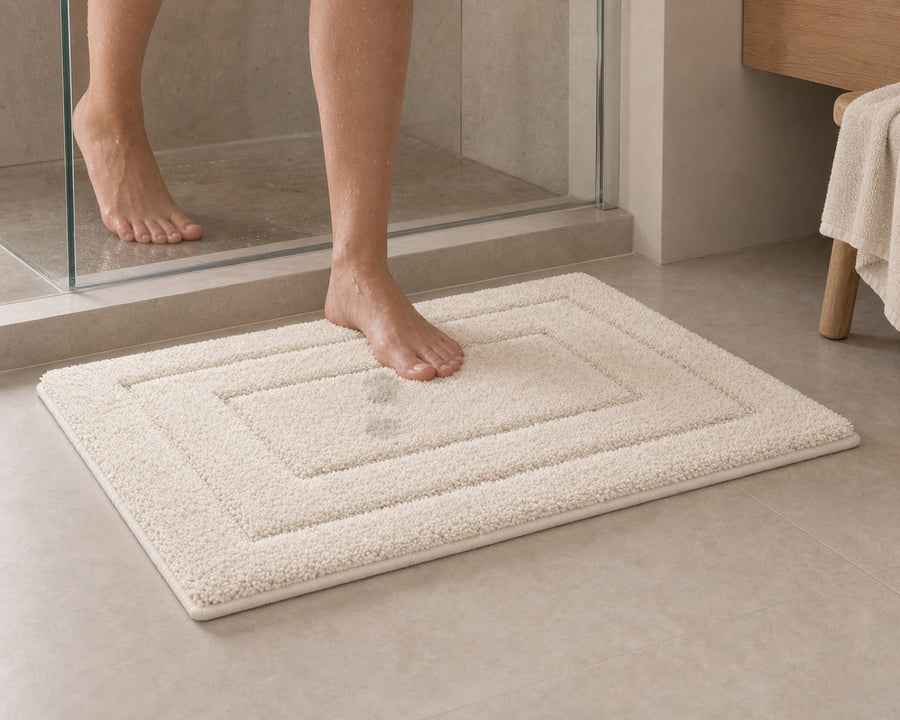 The mat in front of a shower, soaking up water underfoot