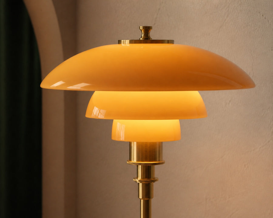 Close view of the three-layer glass shade lit