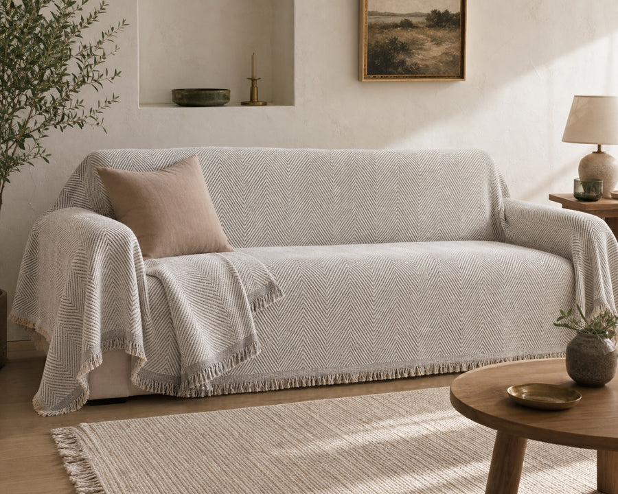The cover draped over a couch, protecting the seat