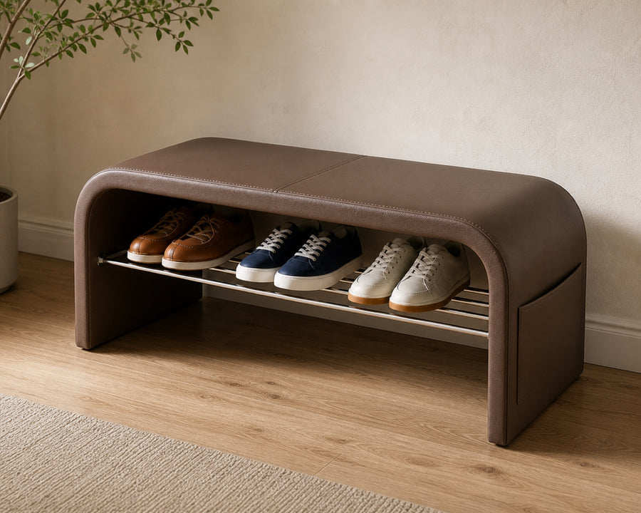 The cushioned seat with shoes on the tier below