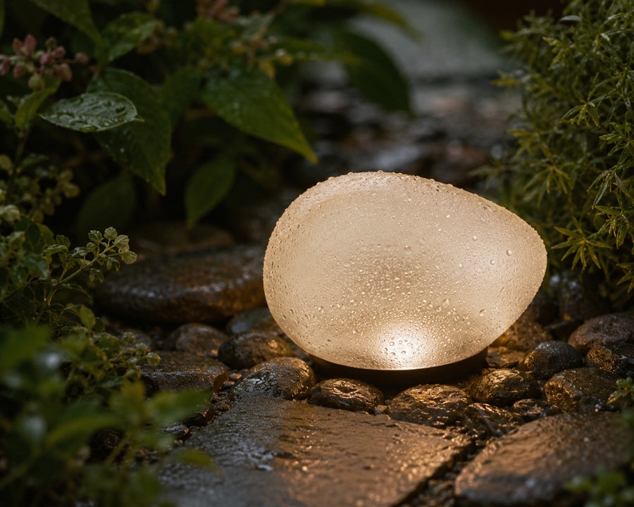 The pebble light in the rain, still glowing
