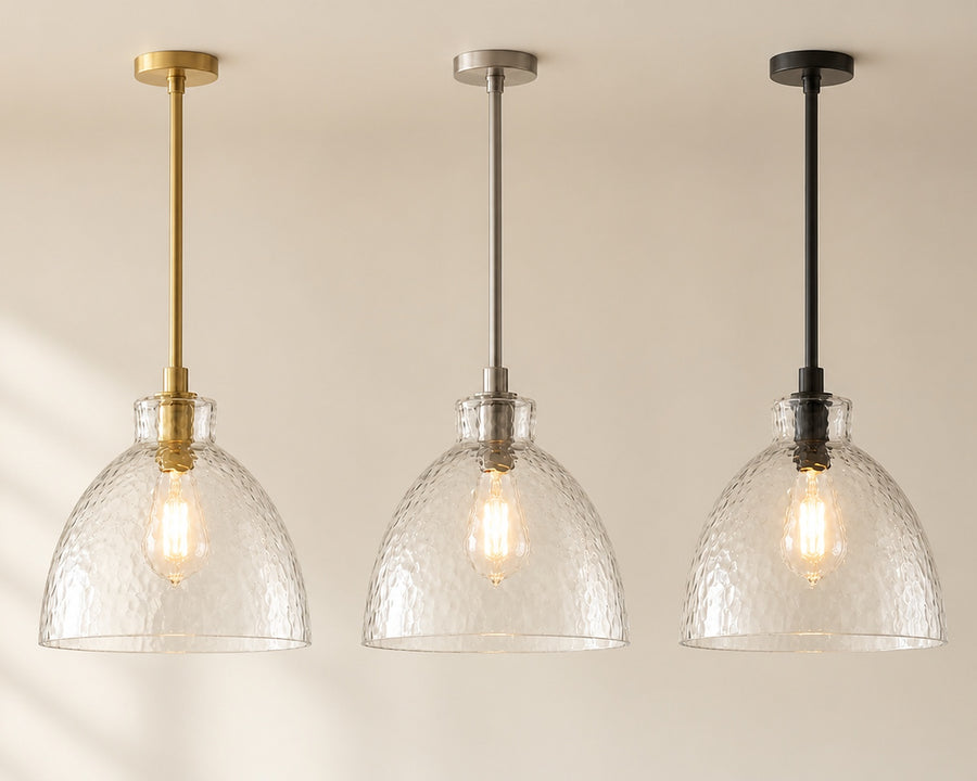 The pendant in brass, nickel, and black