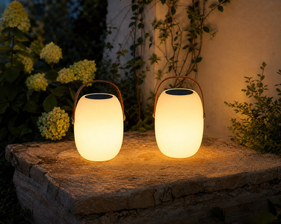 The two lamp sizes shown together in a garden