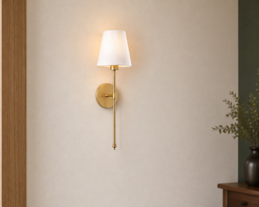 A sconce mounted on a bedroom wall with no visible cord