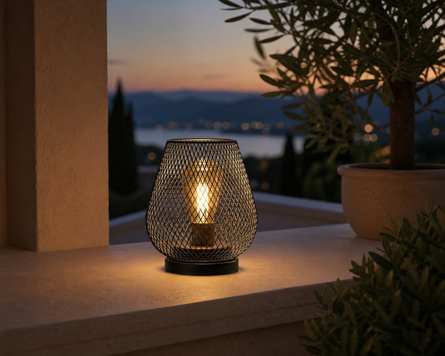 One lamp on a sheltered patio ledge
