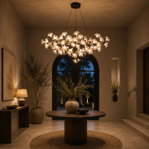 Gingko chandelier as a statement over a foyer table at dusk, black branches